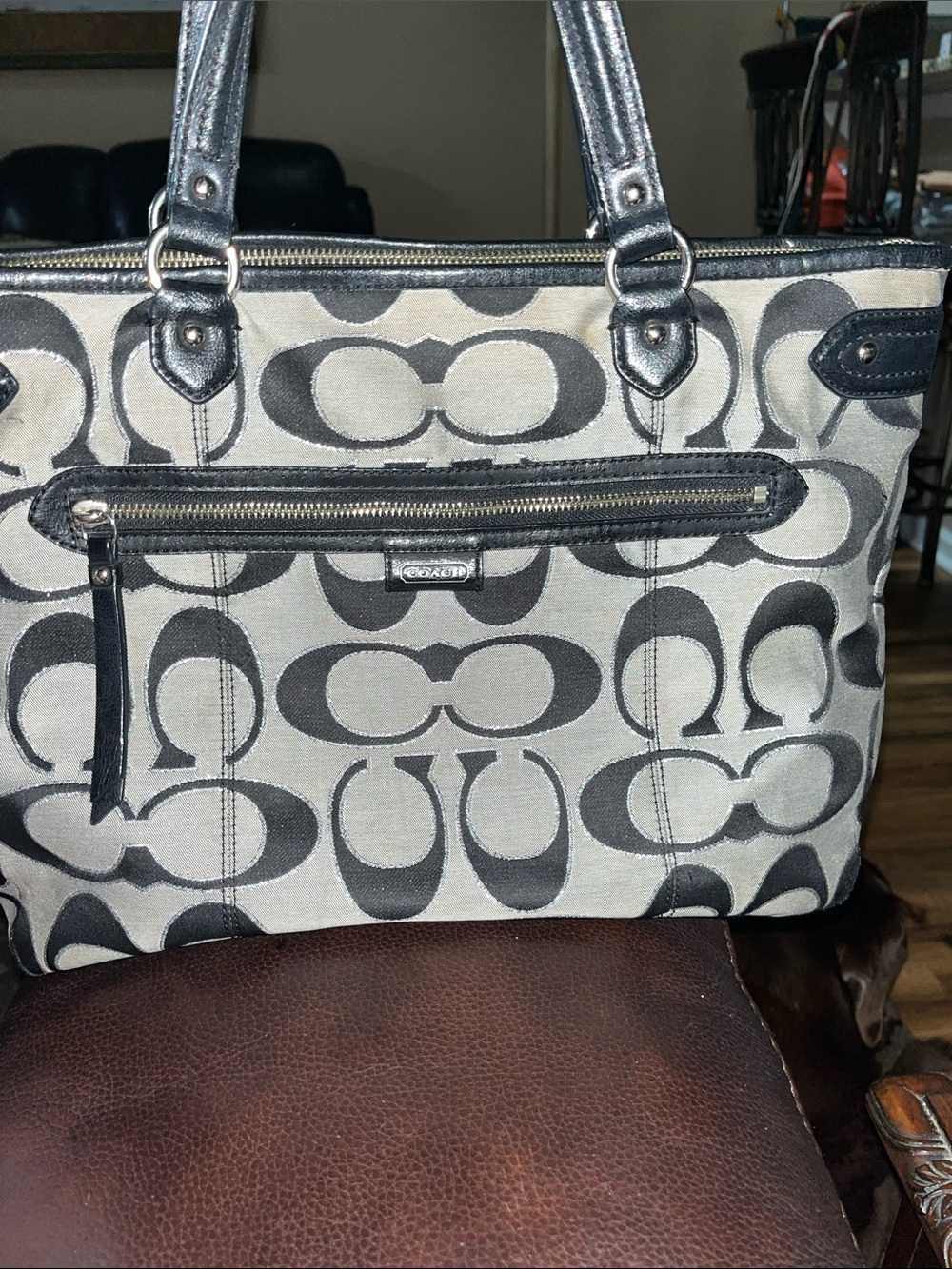 Coach Signature Handbag staining around zipper inside